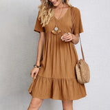 Brown V-neck tiered midi dress with short sleeves and gathered skirt