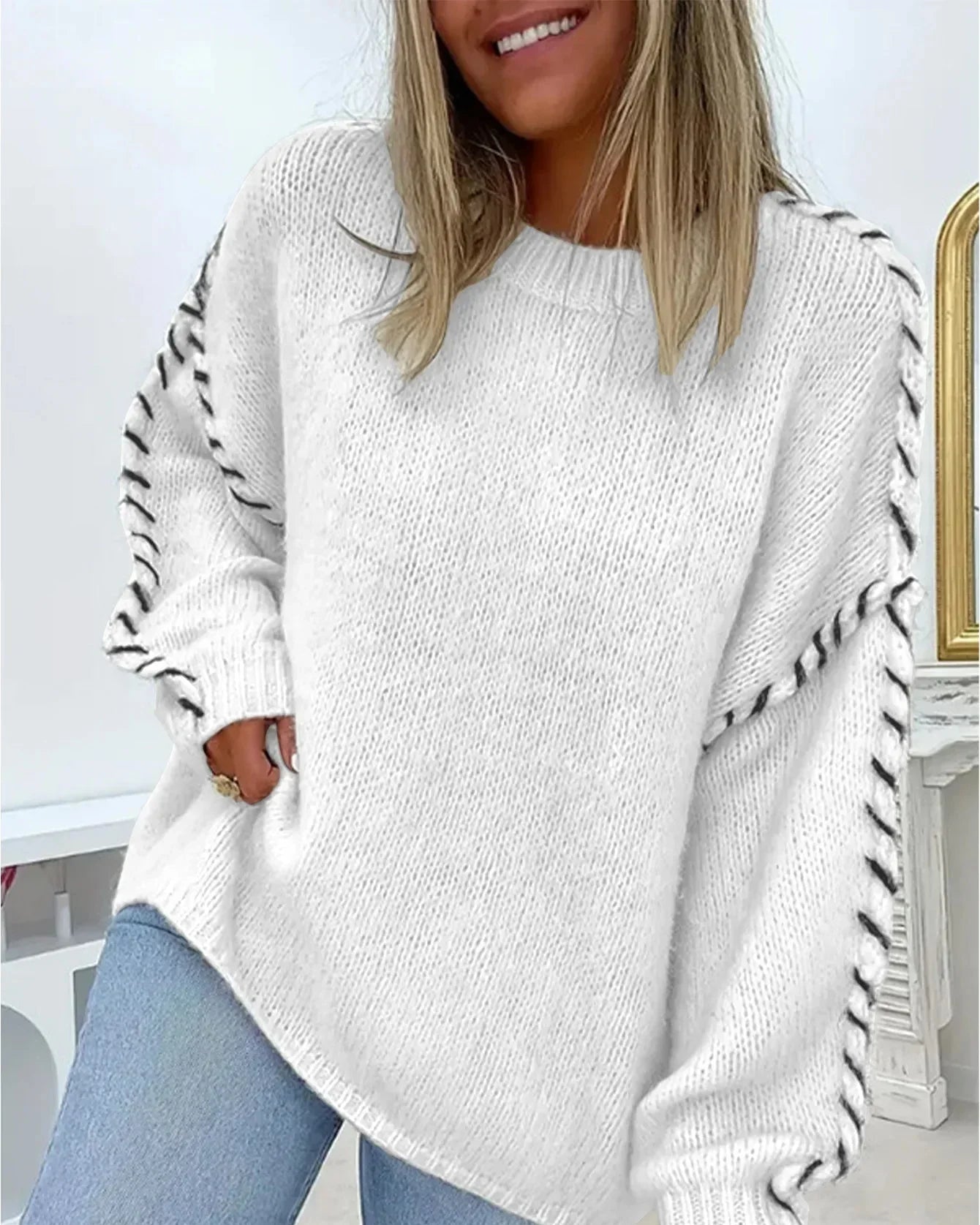 White chunky knit pullover with crew neck and contrast stitched puff sleeves