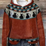 Rust orange hoodie with patterned fair isle yoke and cat silhouettes
