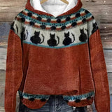 Rust orange hoodie with patterned fair isle yoke and cat silhouettes