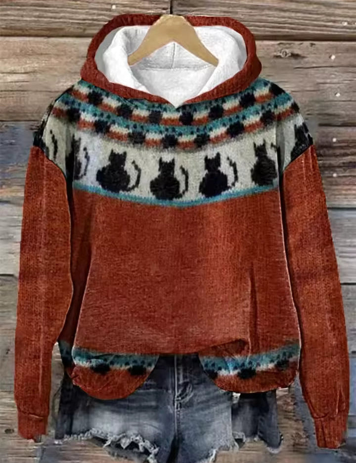 Rust orange hoodie with patterned fair isle yoke and cat silhouettes