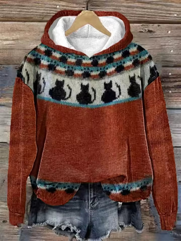 Rust orange hoodie with patterned fair isle yoke and cat silhouettes