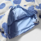 Light blue lined jacket interior with zipper opening on heart-pattern fleece