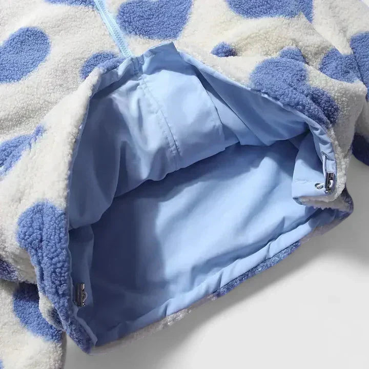 Light blue lined jacket interior with zipper opening on heart-pattern fleece