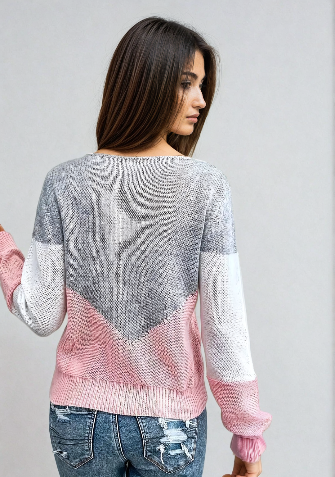 Loose knit sweater back, gray knit with pink hem and white sleeve cuffs