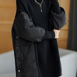 Black patchwork turtleneck sweater with ribbed cuffs and quilted front detailing