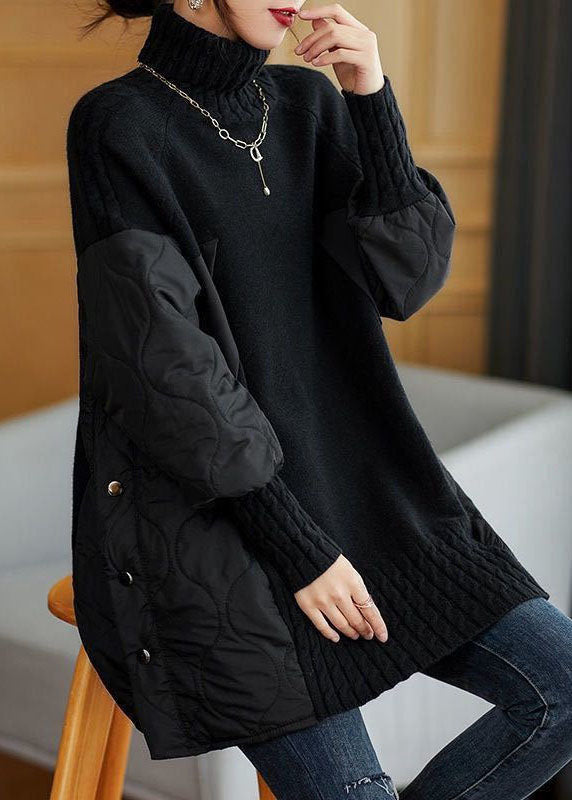 Black patchwork turtleneck sweater with ribbed knit hem and quilted arm panels