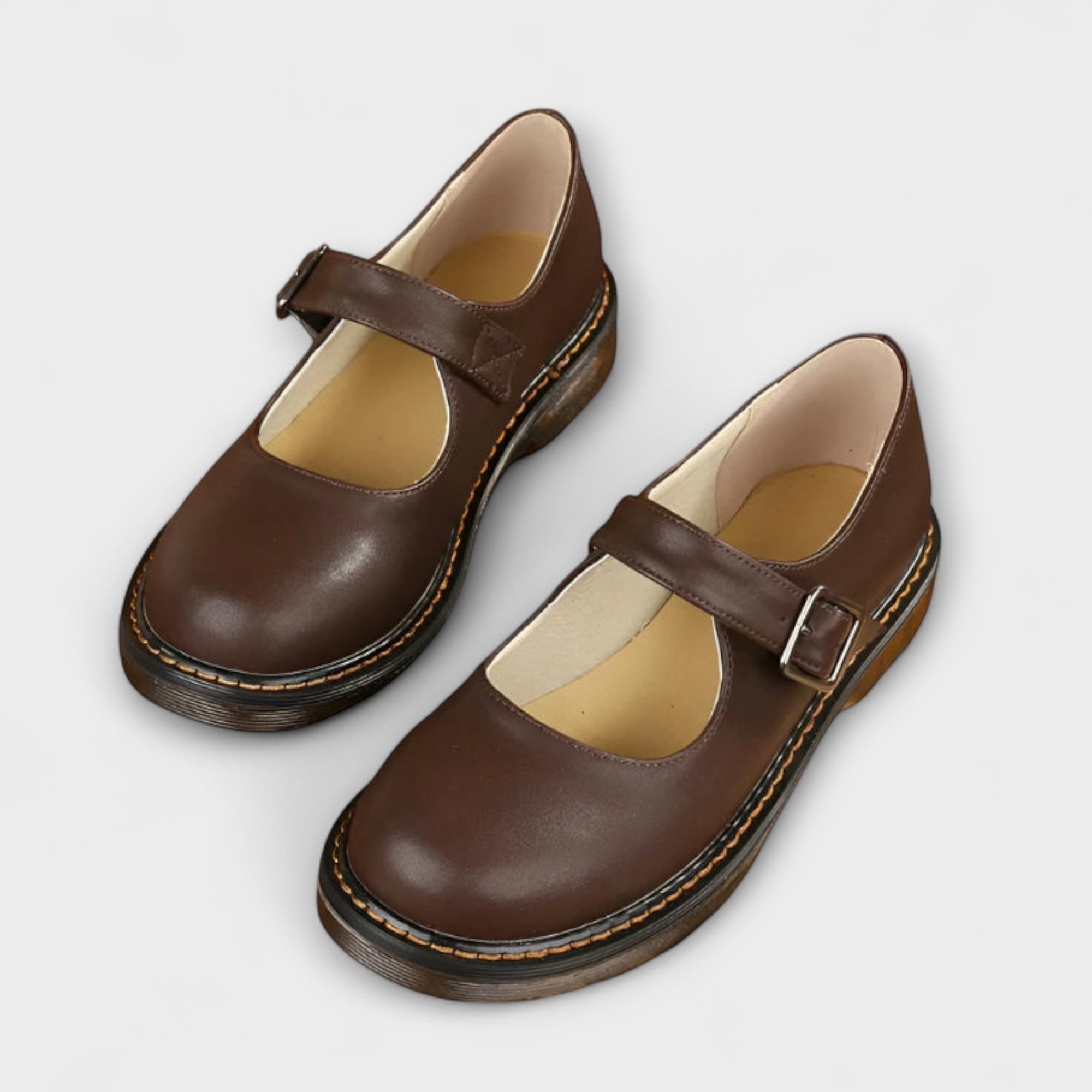 Brown Mary Jane shoes with ankle strap buckle and cushioned platform sole