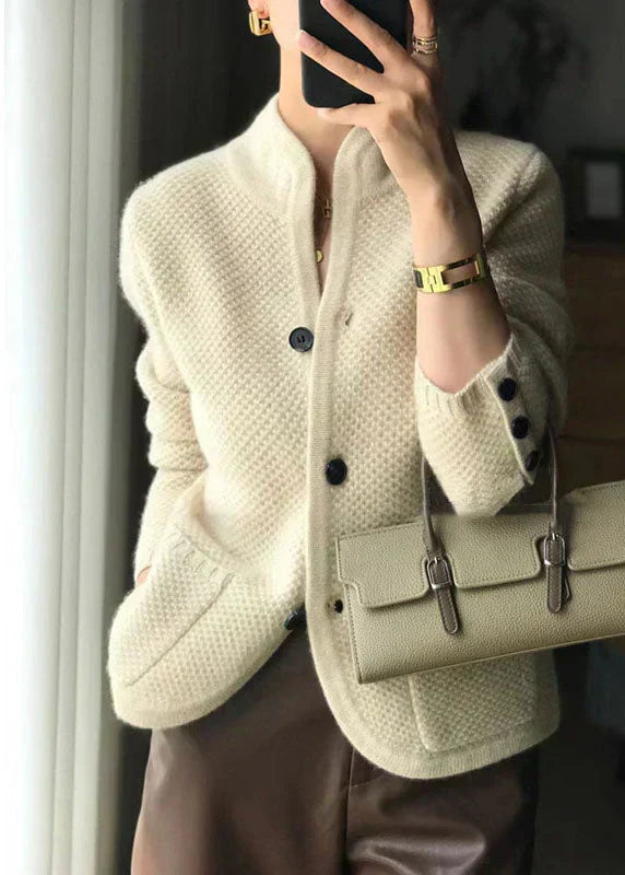 Off-white chunky knit cardigan with button front, dark cuff buttons