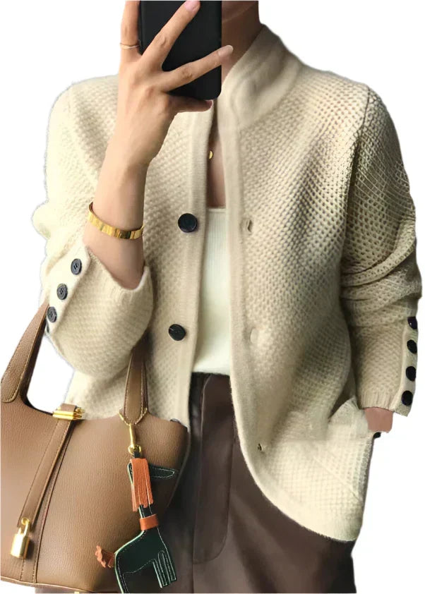 Off-white button-front knit cardigan with dark buttons and ribbed cuffs
