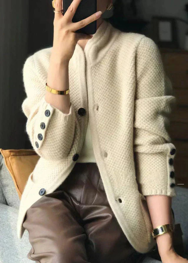 Off-white cozy knit cardigan with button placket and dark cuff buttons
