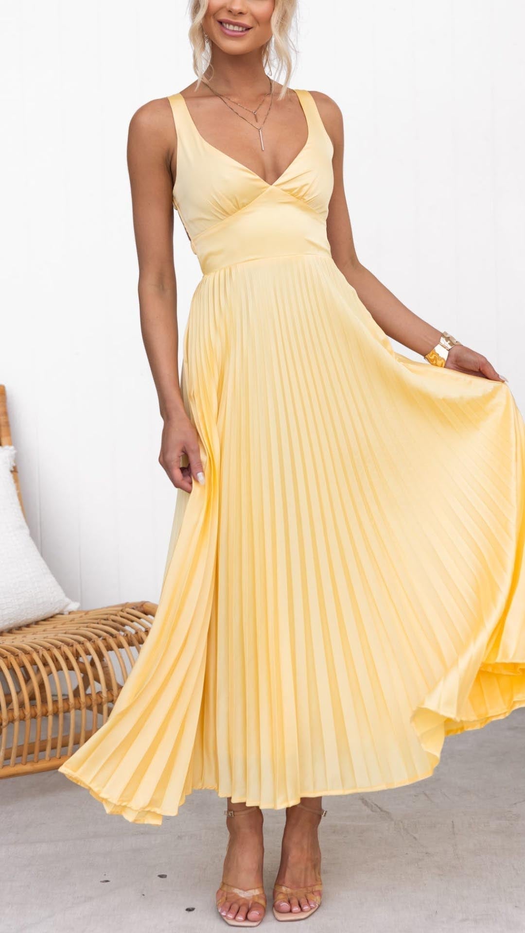 Yellow pleated V-neck maxi dress with spaghetti straps and fitted bodice