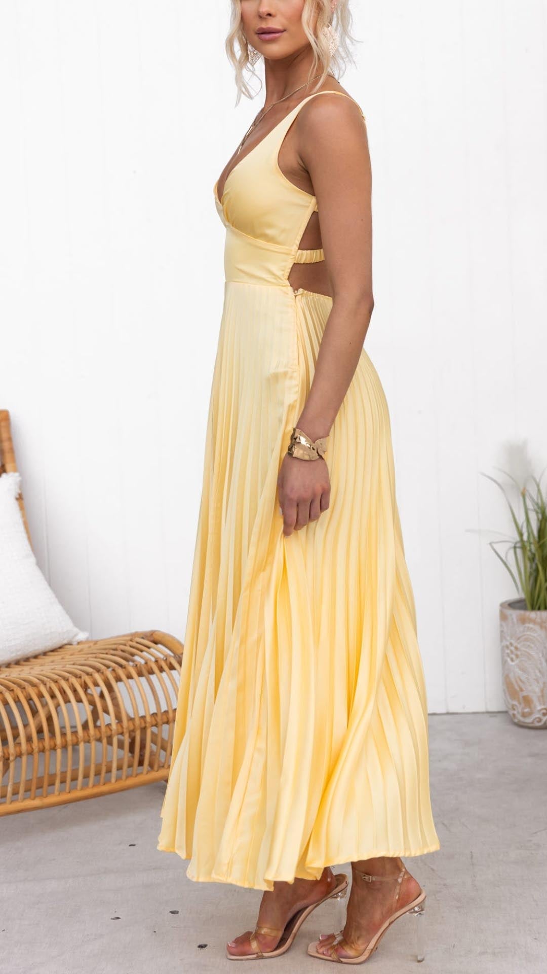 Yellow pleated maxi dress with V-neck, draped twist bodice and thin straps