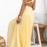 Yellow pleated maxi dress with V-neck and open back strap detail