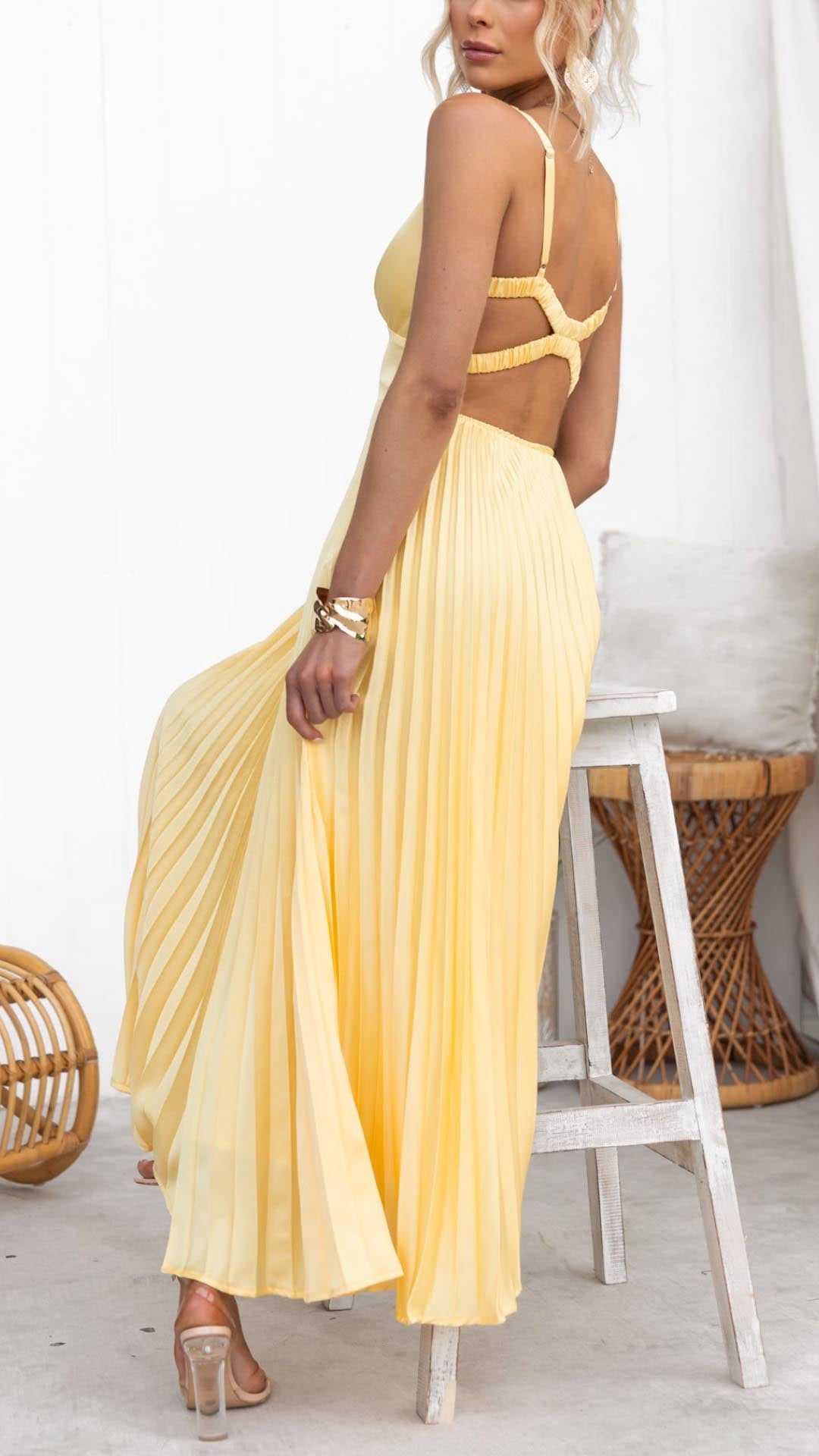 Yellow pleated maxi dress with V-neck and open back strap detail