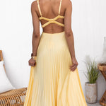 Yellow pleated maxi dress, crisscross back straps and open-back neckline shape