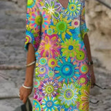 Floral print V-neck dress, loose fit, colorful circular flower pattern in teal and pink