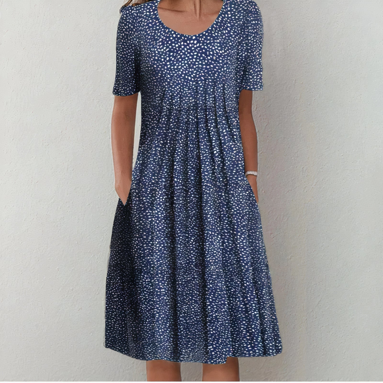 Navy polka-dot midi dress with scoop neckline and short sleeves, gathered skirt