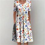 Floral midi dress with scoop neckline and short sleeves, gathered skirt