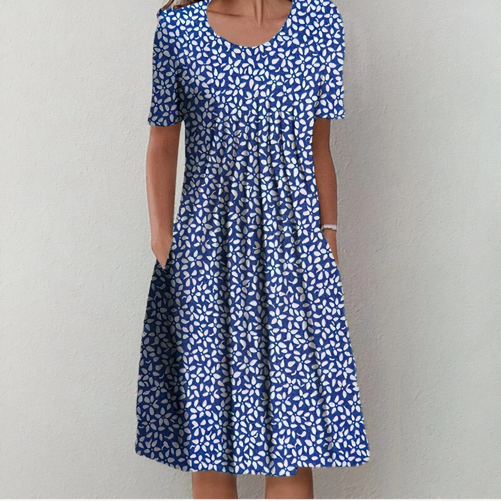 Blue patterned midi dress with scoop neckline and short sleeves, gathered skirt