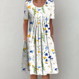 White floral midi dress with scoop neckline and short sleeves, gathered skirt