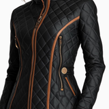 Black quilted padded jacket with stand collar, zip pockets, and tan contrast piping