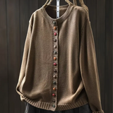 Taupe knit cardigan with ribbed trim and multicolor button-front placket.