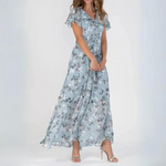 Light blue floral midi dress with V-neck bodice and gathered tiered skirt
