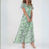 Green floral midi dress with V-neck and flutter sleeves, tiered A-line skirt