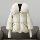White puffer jacket with white faux fur collar, front zip and flap pockets