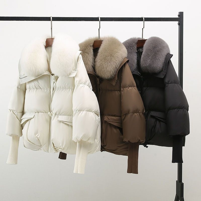 Hanging winter puffer jackets: white, brown, and black with faux fur collars
