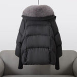 Black puffer jacket back view with gray faux fur collar and elastic cuffs