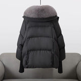 Black puffer jacket back view with gray faux fur collar and elastic cuffs