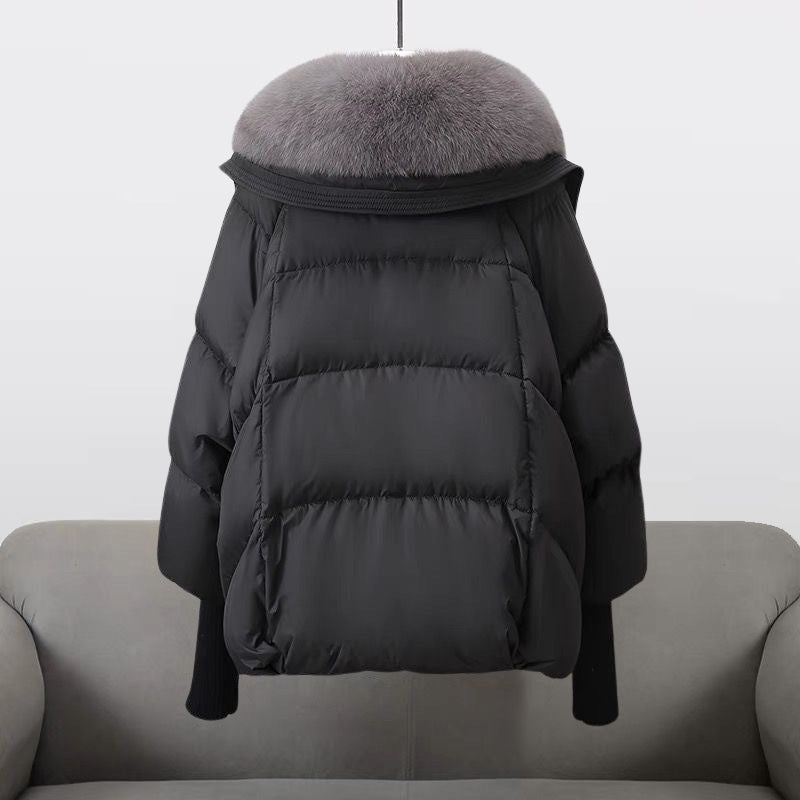 Black puffer jacket back view with gray faux fur collar and elastic cuffs