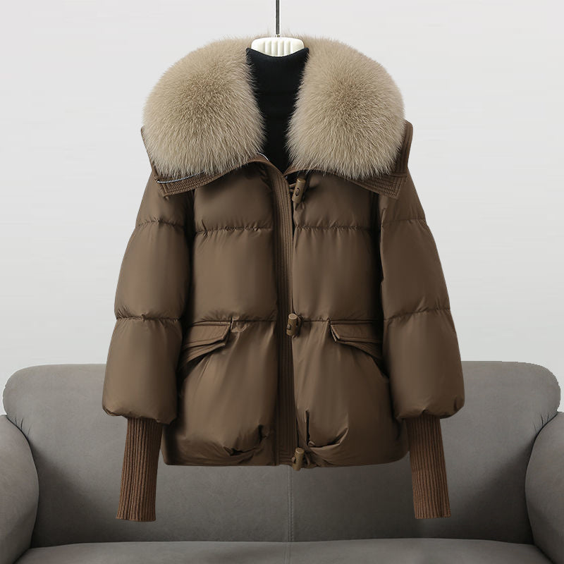 Brown puffer jacket with beige faux fur collar, front zip and flap pockets
