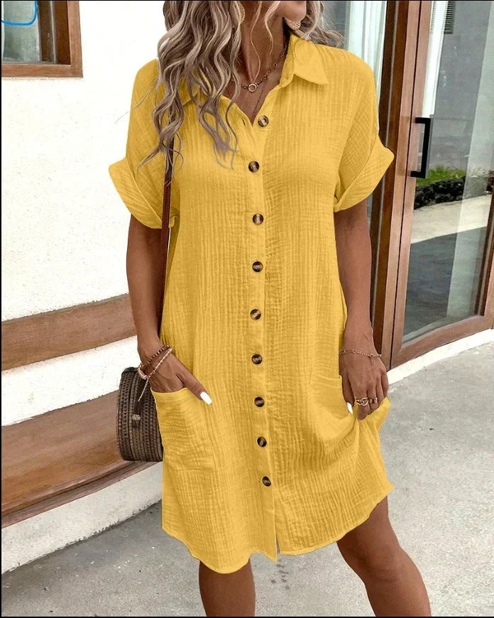Yellow polo shirt dress with short sleeves, button placket, and side pockets