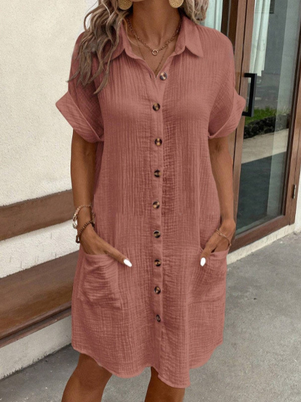 Dusty rose polo shirt dress with short sleeves, button placket, and side pockets