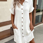 White polo shirt dress with short sleeves, button placket, and side pockets