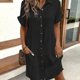 Black polo shirt dress with short sleeves, button placket, and side pockets