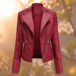 Red moto jacket with notched lapels, zip pockets, and zipper front closure
