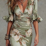 Kassy green floral maxi dress with draped V-neck, ruched waist, and ruffled sleeves