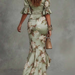 Kassy green floral maxi dress, back view with gathered seams and ruffled hem