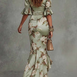 Kassy green floral maxi dress, back view with gathered seams and ruffled hem