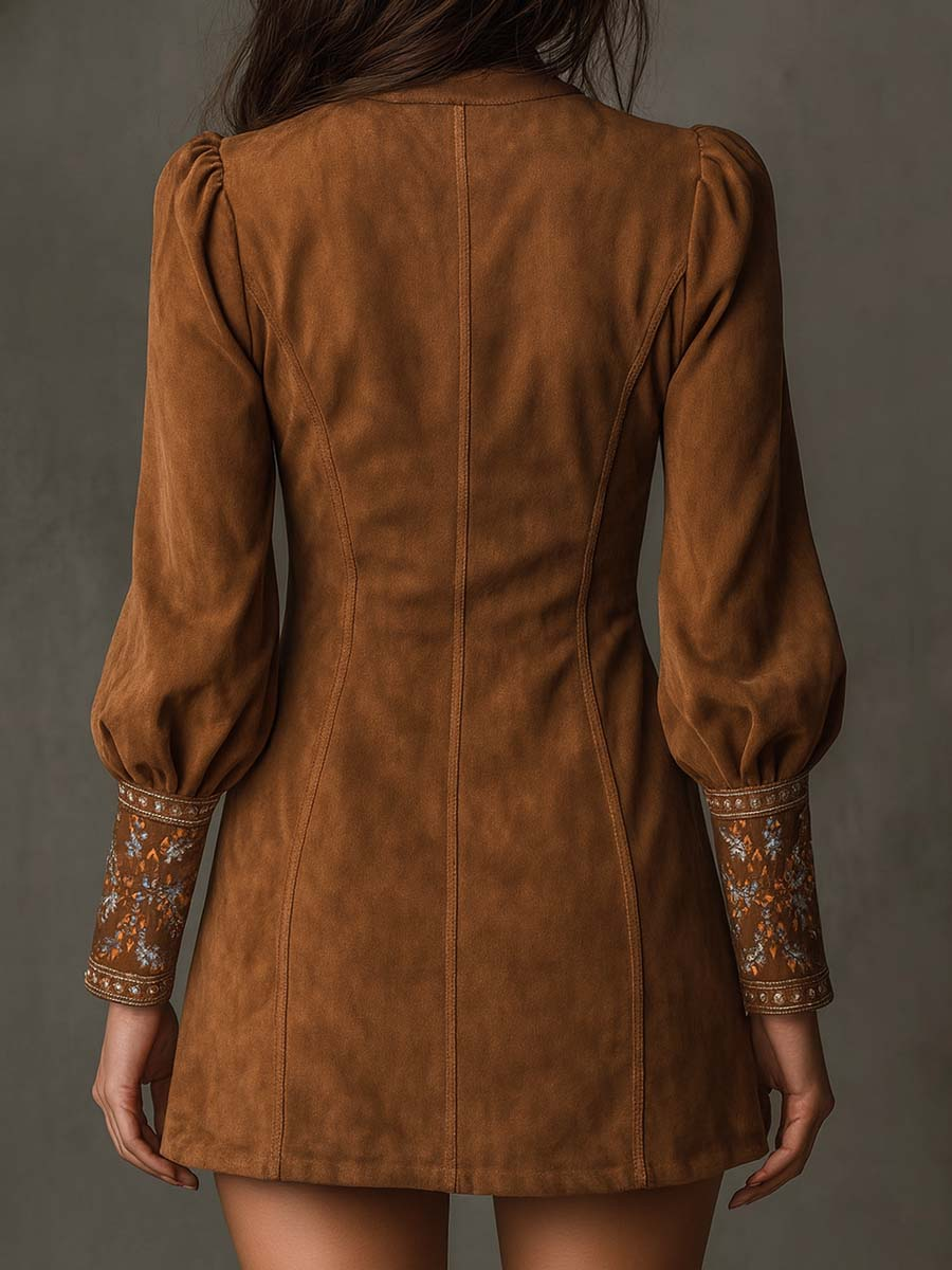 Brown suede mini dress back view with gathered puff sleeves and embroidered cuffs