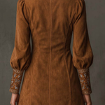 Brown suede mini dress back view with gathered puff sleeves and embroidered cuffs