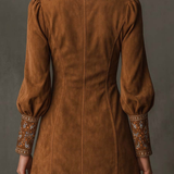 Brown suede mini dress back view with gathered puff sleeves and embroidered cuffs