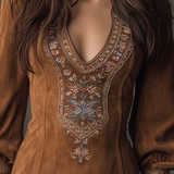 Brown suede minidress front with ornate V-stitch embroidery and long sleeves