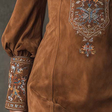 Brown suede mini dress with embroidered cuffs and V-neck trim