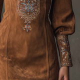 Brown suede minidress with central floral embroidery and long cuffed sleeves