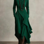 Green long-sleeve maxi dress with high neck and cascading draped wrap skirt